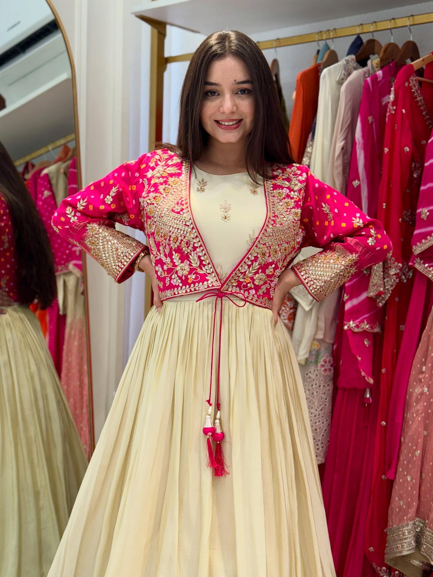 Designer Ivory Floor-Length Anarkali Gown with Contrast Pink Embroidered Jacket, Intricate Thread & Zari Work Detailing – Perfect for Weddings, Parties & Festive Celebrations