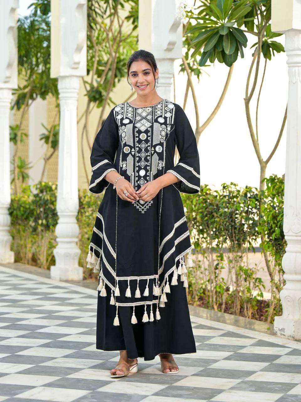 Elegant Black Handcrafted Cotton Kurta Set with Intricate White Mirror Work Embroidery, Asymmetric Hemline, and Tassel Detailing – Bohemian Ethnic Wear for Women – Includes Wide-Leg Pants – Ideal for Festive & Casual Occasions