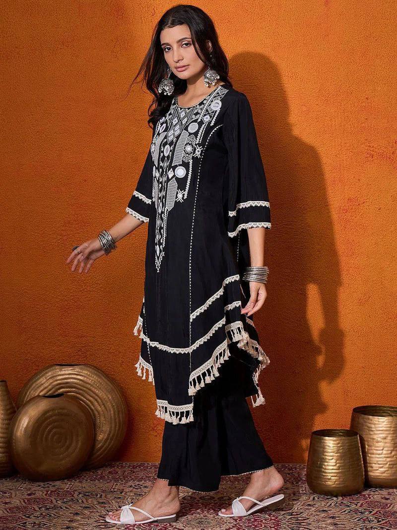 Elegant Black Handcrafted Cotton Kurta Set with Intricate White Mirror Work Embroidery, Asymmetric Hemline, and Tassel Detailing – Bohemian Ethnic Wear for Women – Includes Wide-Leg Pants – Ideal for Festive & Casual Occasions