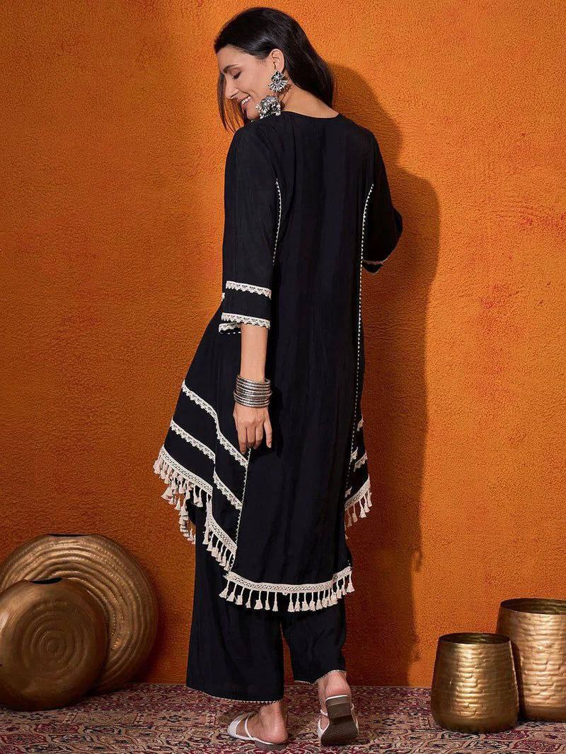 Elegant Black Handcrafted Cotton Kurta Set with Intricate White Mirror Work Embroidery, Asymmetric Hemline, and Tassel Detailing – Bohemian Ethnic Wear for Women – Includes Wide-Leg Pants – Ideal for Festive & Casual Occasions