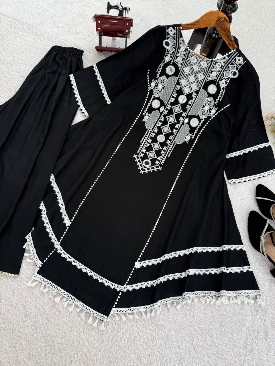 Elegant Black Handcrafted Cotton Kurta Set with Intricate White Mirror Work Embroidery, Asymmetric Hemline, and Tassel Detailing – Bohemian Ethnic Wear for Women – Includes Wide-Leg Pants – Ideal for Festive & Casual Occasions