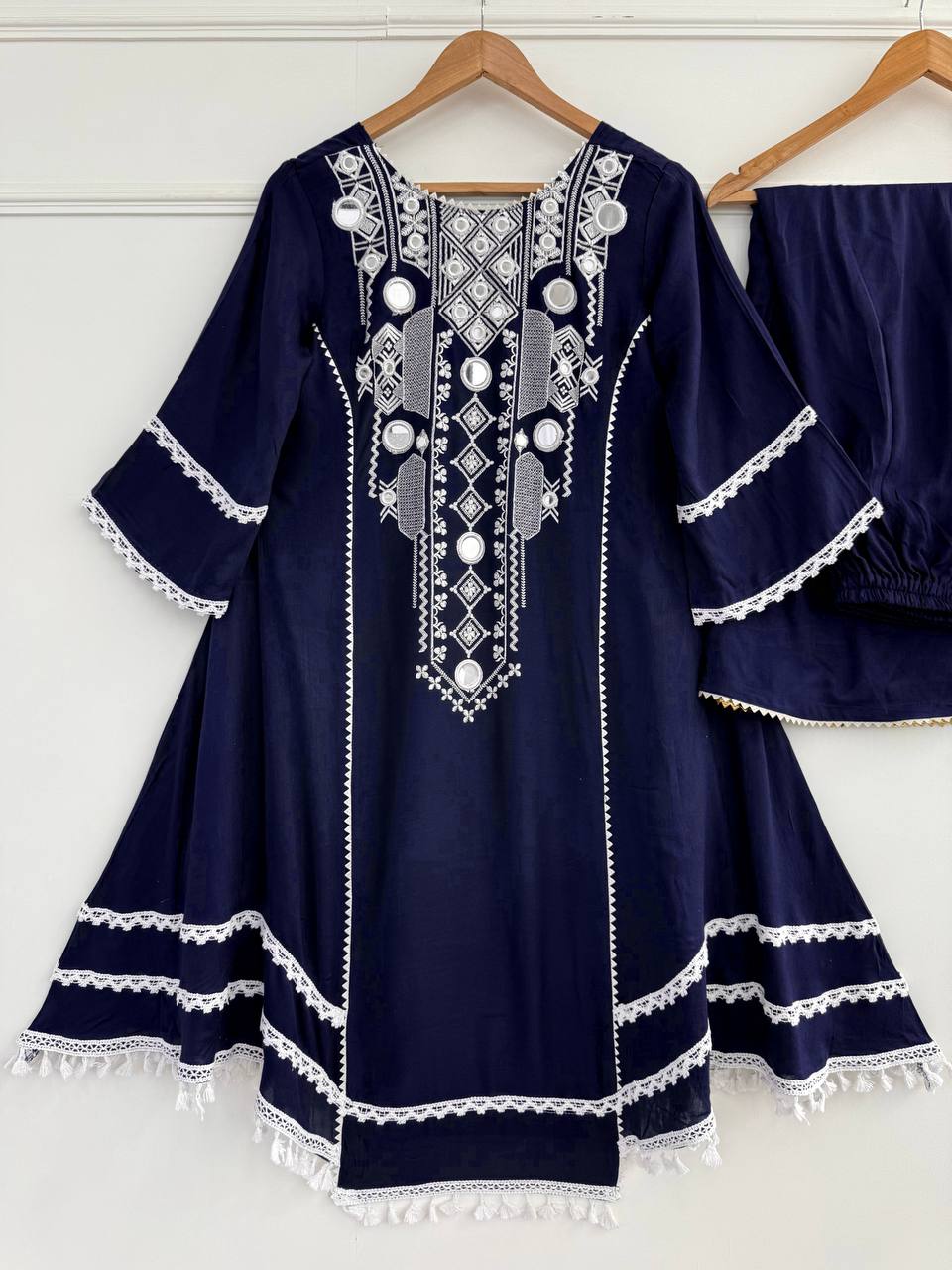 Elegant Black Handcrafted Cotton Kurta Set with Intricate White Mirror Work Embroidery, Asymmetric Hemline, and Tassel Detailing – Bohemian Ethnic Wear for Women – Includes Wide-Leg Pants – Ideal for Festive & Casual Occasions