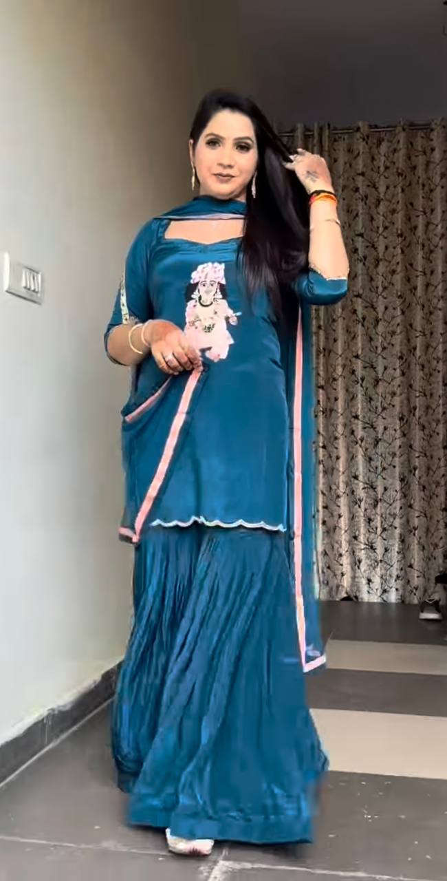 it's a stylish Indo-western ethnic set with a devotional (Krishna ) and modern flair