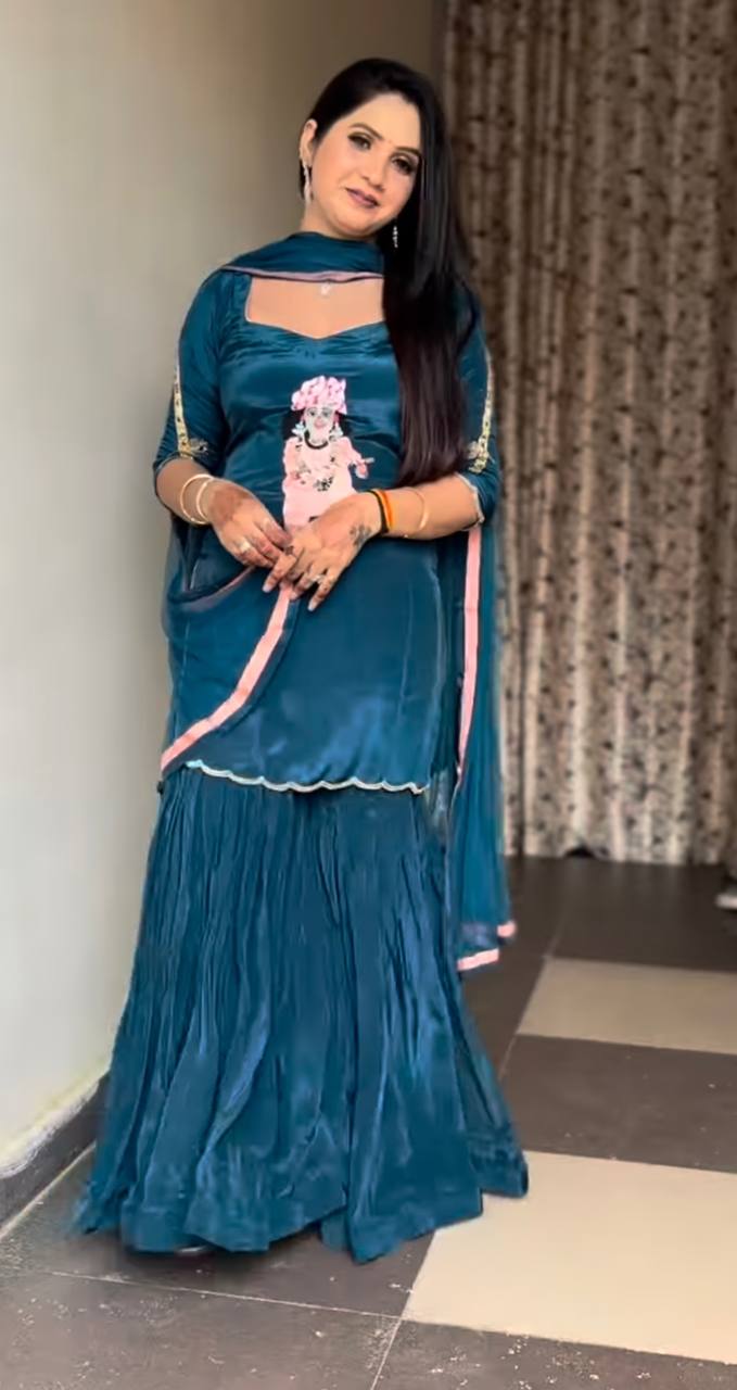 it's a stylish Indo-western ethnic set with a devotional (Krishna ) and modern flair