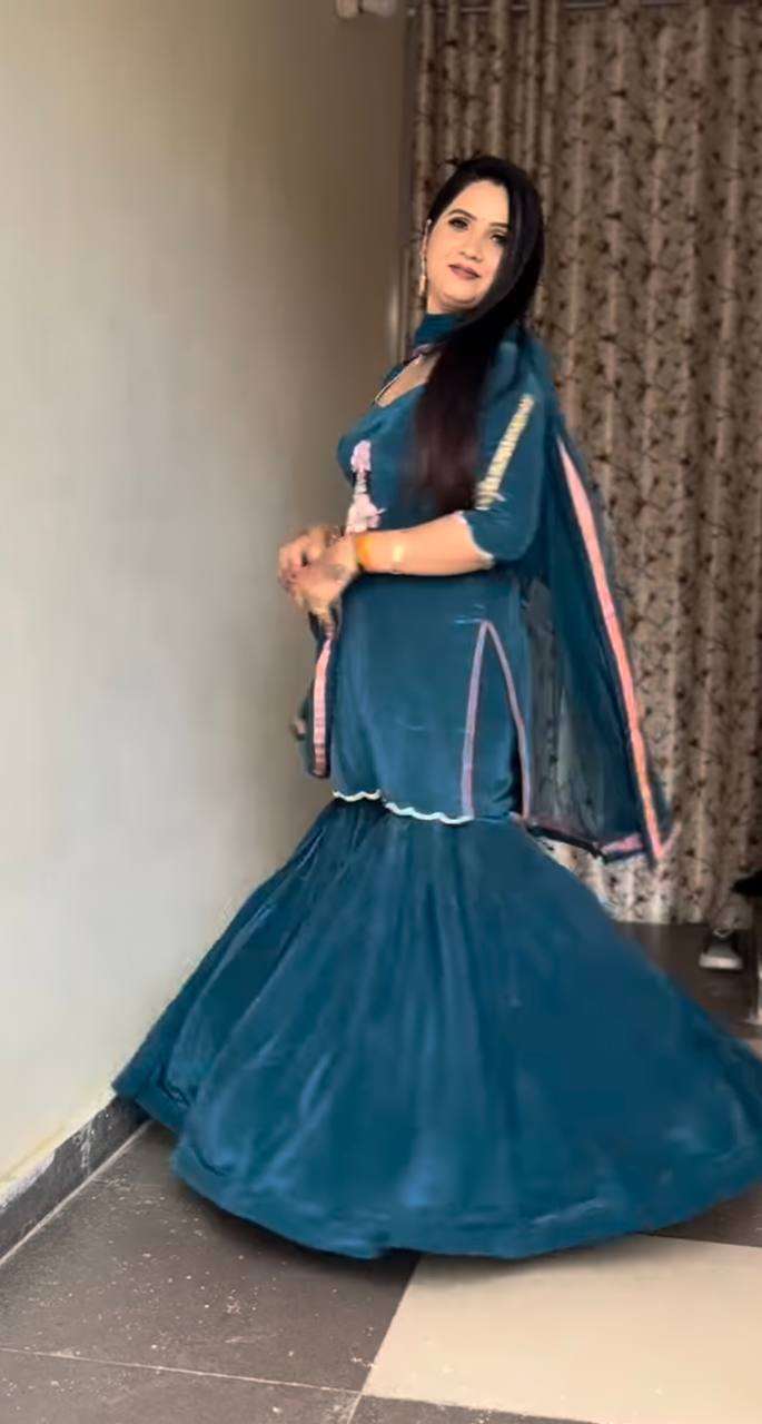 it's a stylish Indo-western ethnic set with a devotional (Krishna ) and modern flair